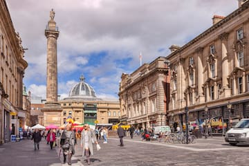 a group of people walking in a city