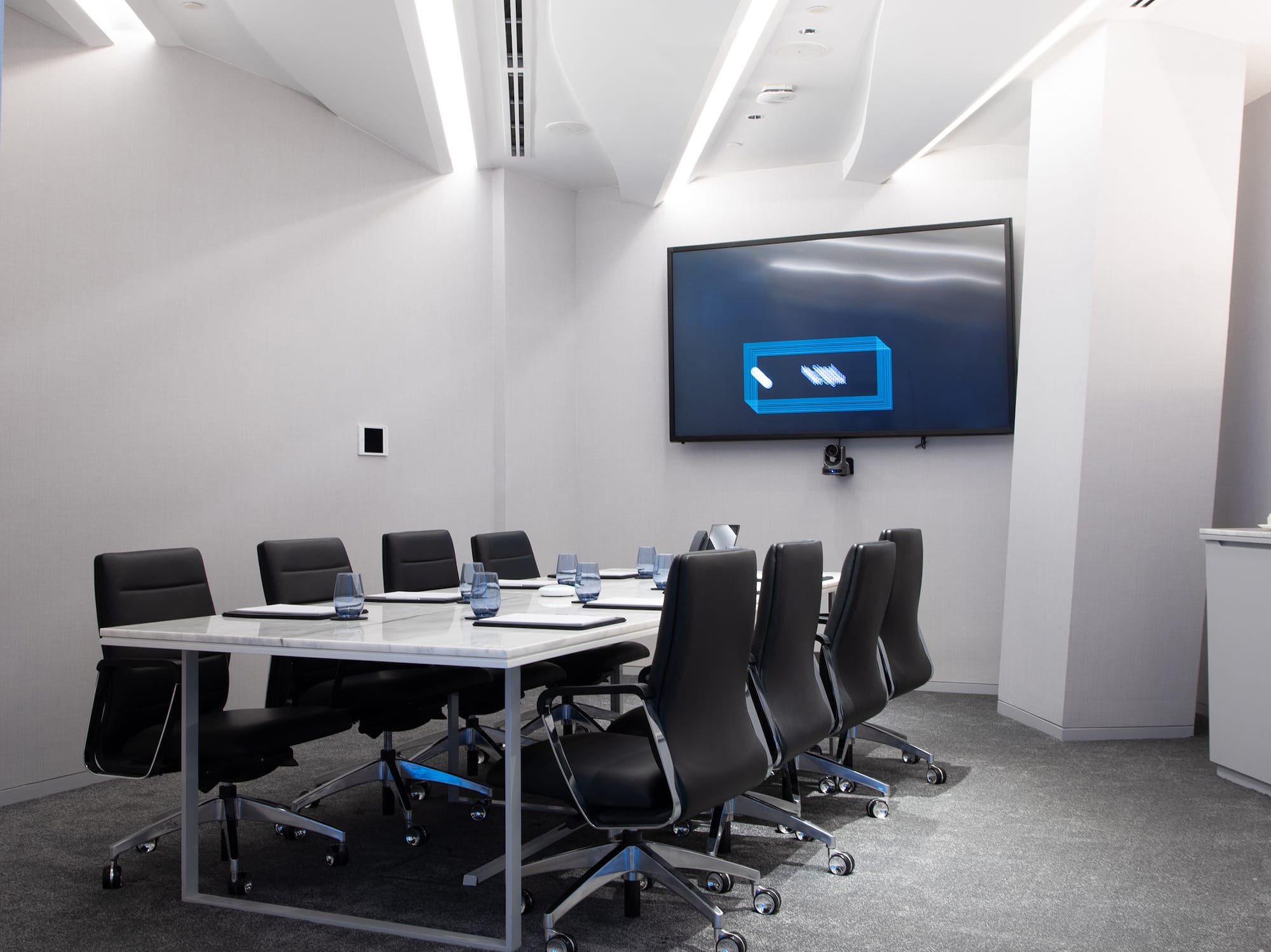 a conference room with a table and chairs.