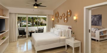 a bedroom with a bed and a ceiling fan