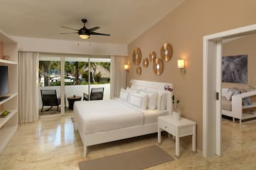a bedroom with a bed and a ceiling fan
