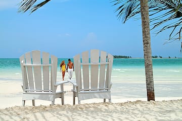 a couple walking on a beach