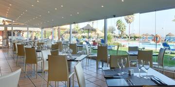 a restaurant with tables and chairs