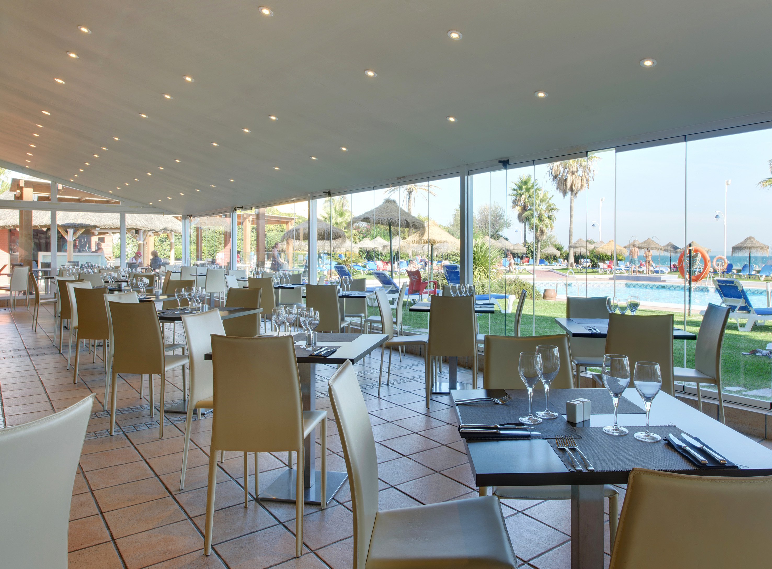 a restaurant with tables and chairs
