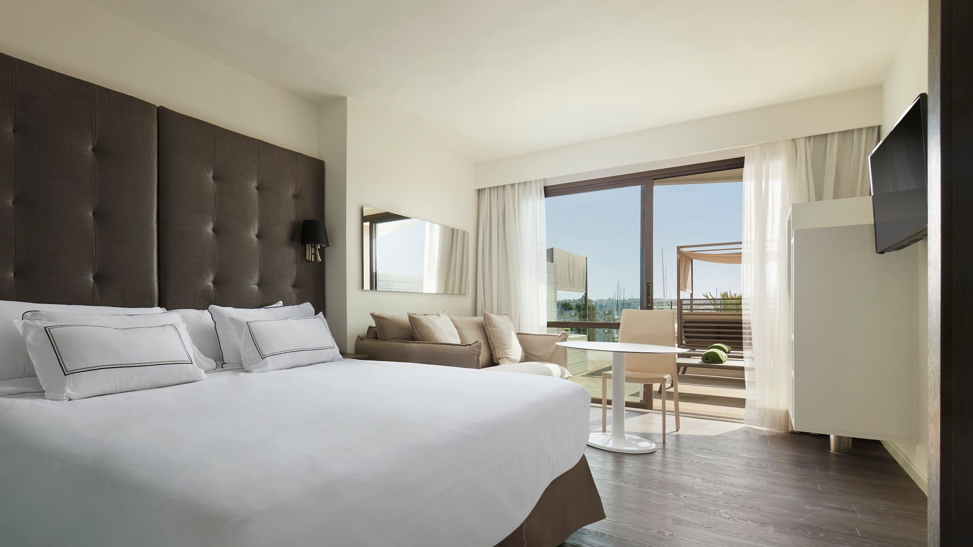 a bedroom with a large bed and a table