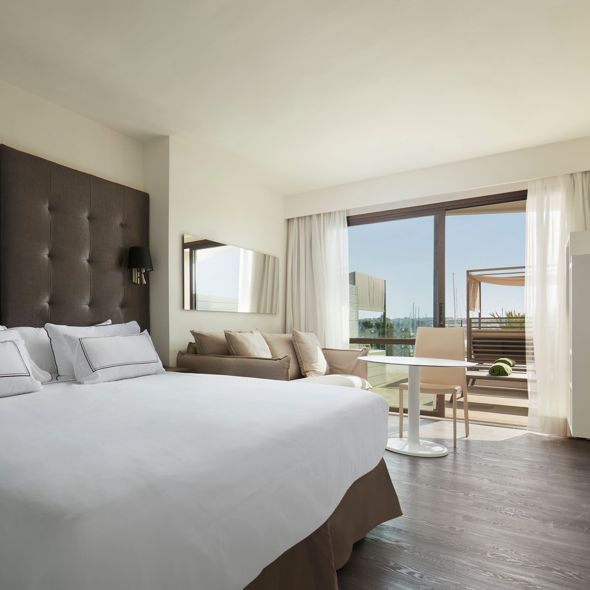 a bedroom with a large bed and a table