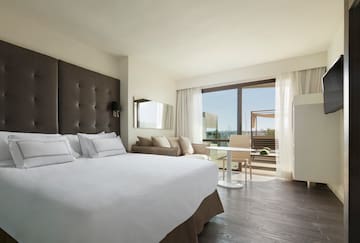 a bedroom with a large bed and a table