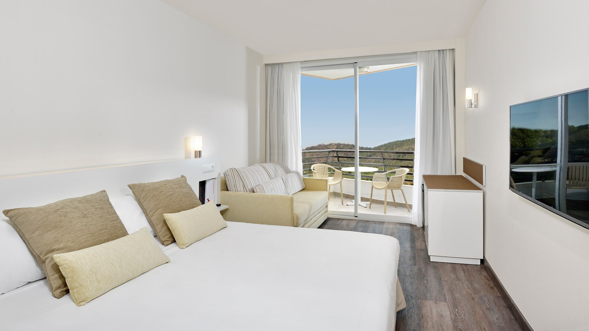 a bedroom with a bed and a couch