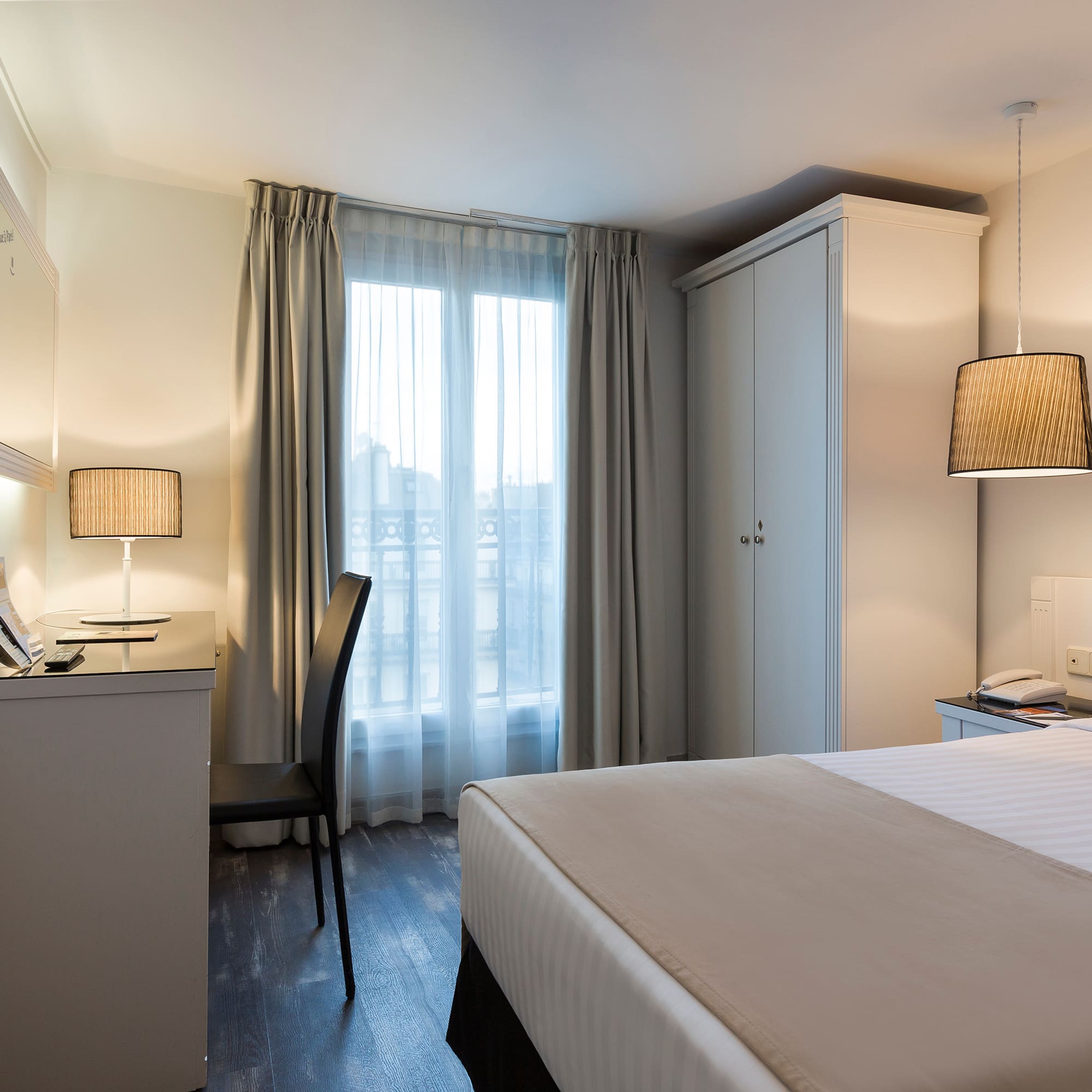 a bedroom with a bed and a desk