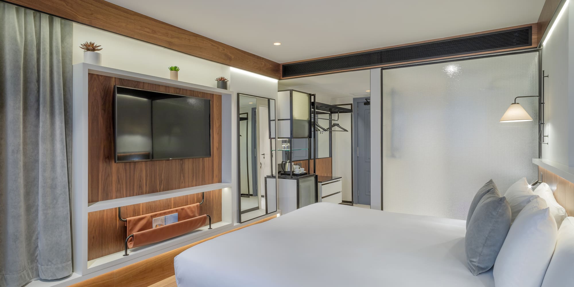 a room with a bed and a tv