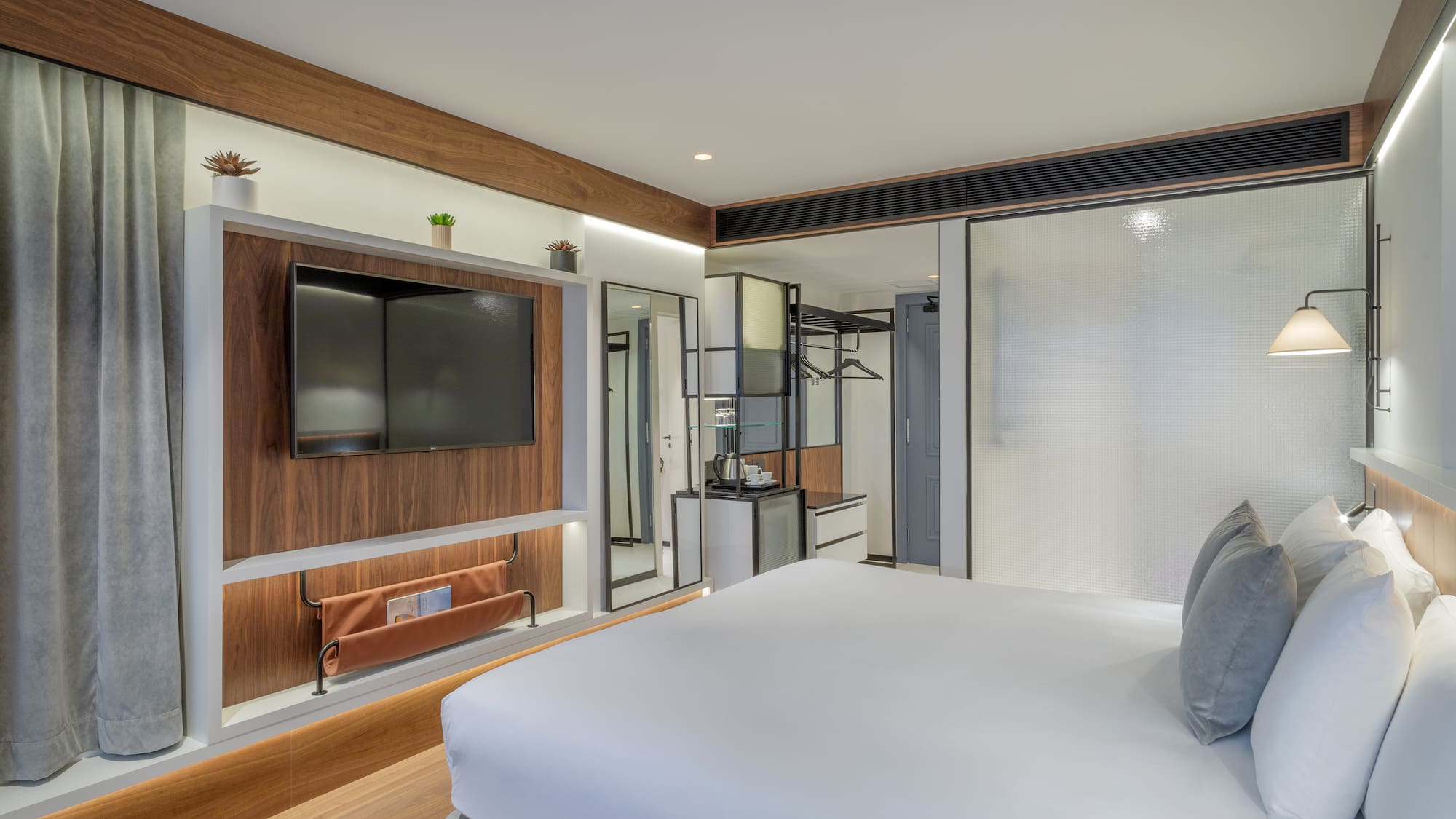 a room with a bed and a tv