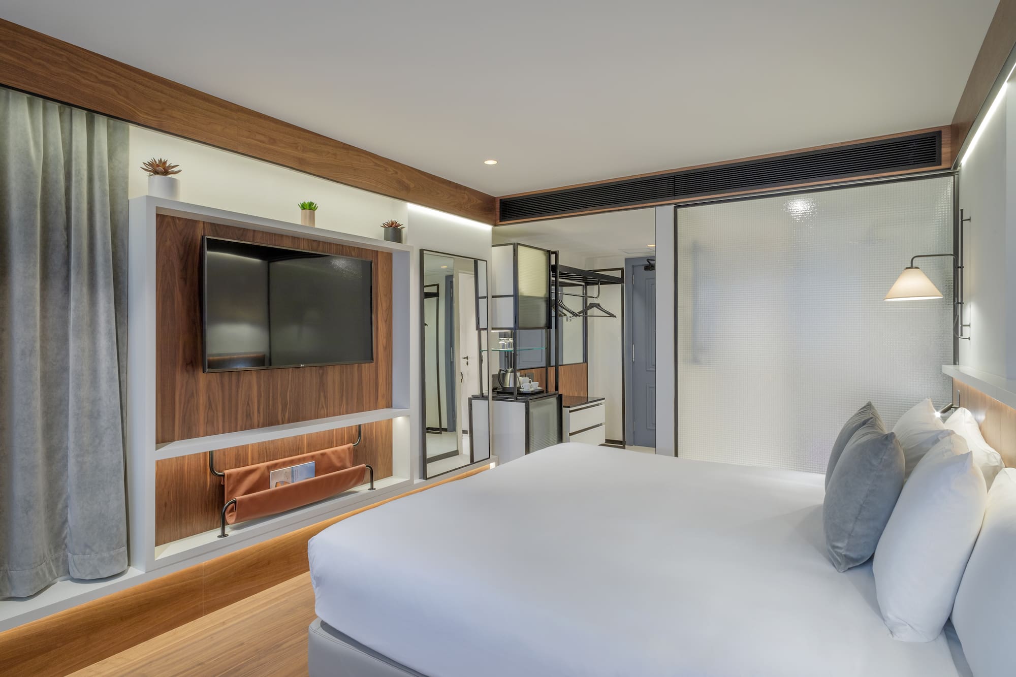 a room with a bed and a tv