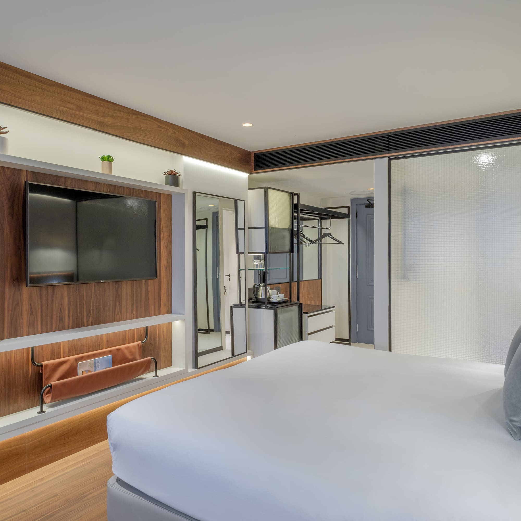 a room with a bed and a tv