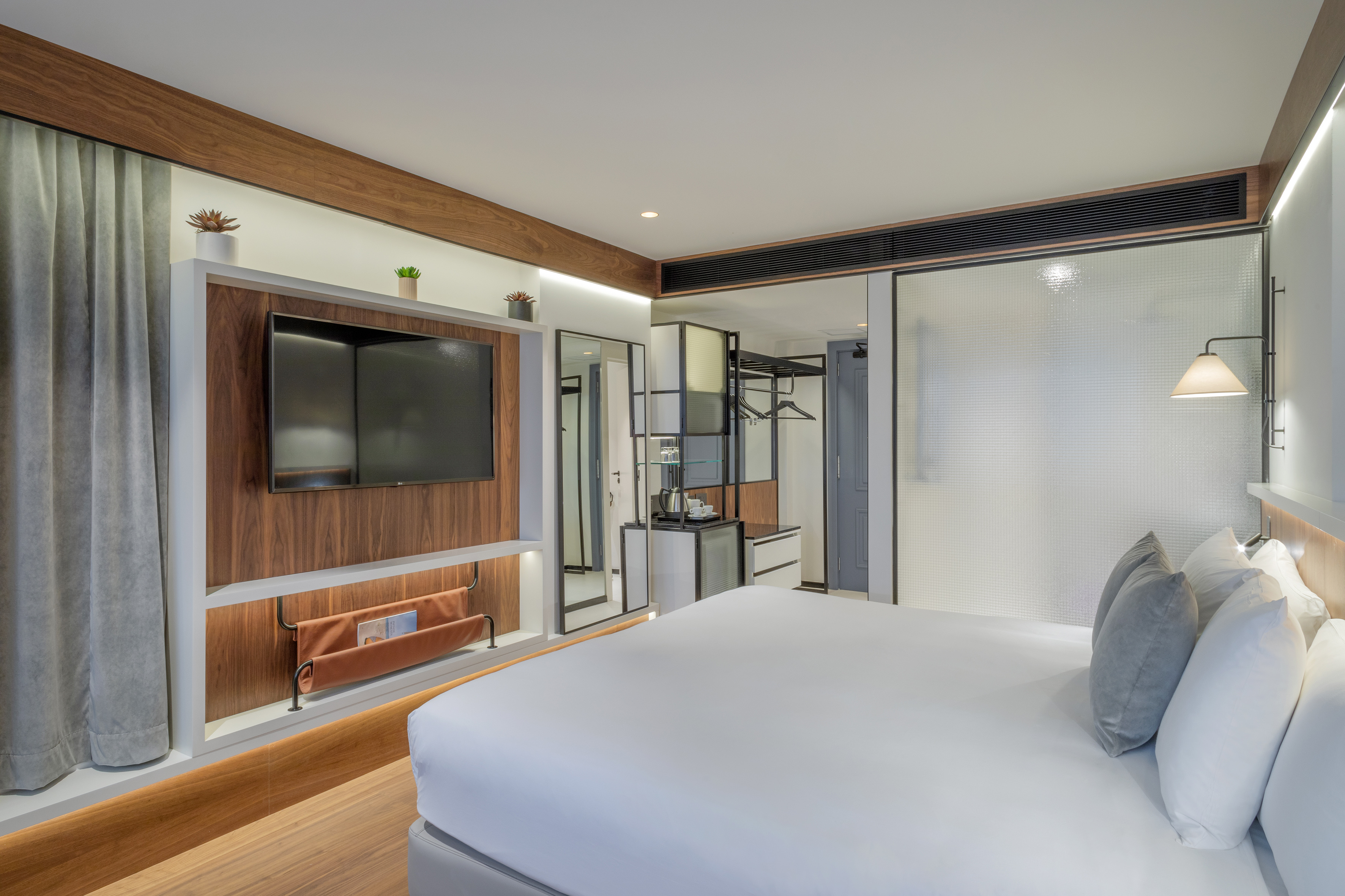 a room with a bed and a tv