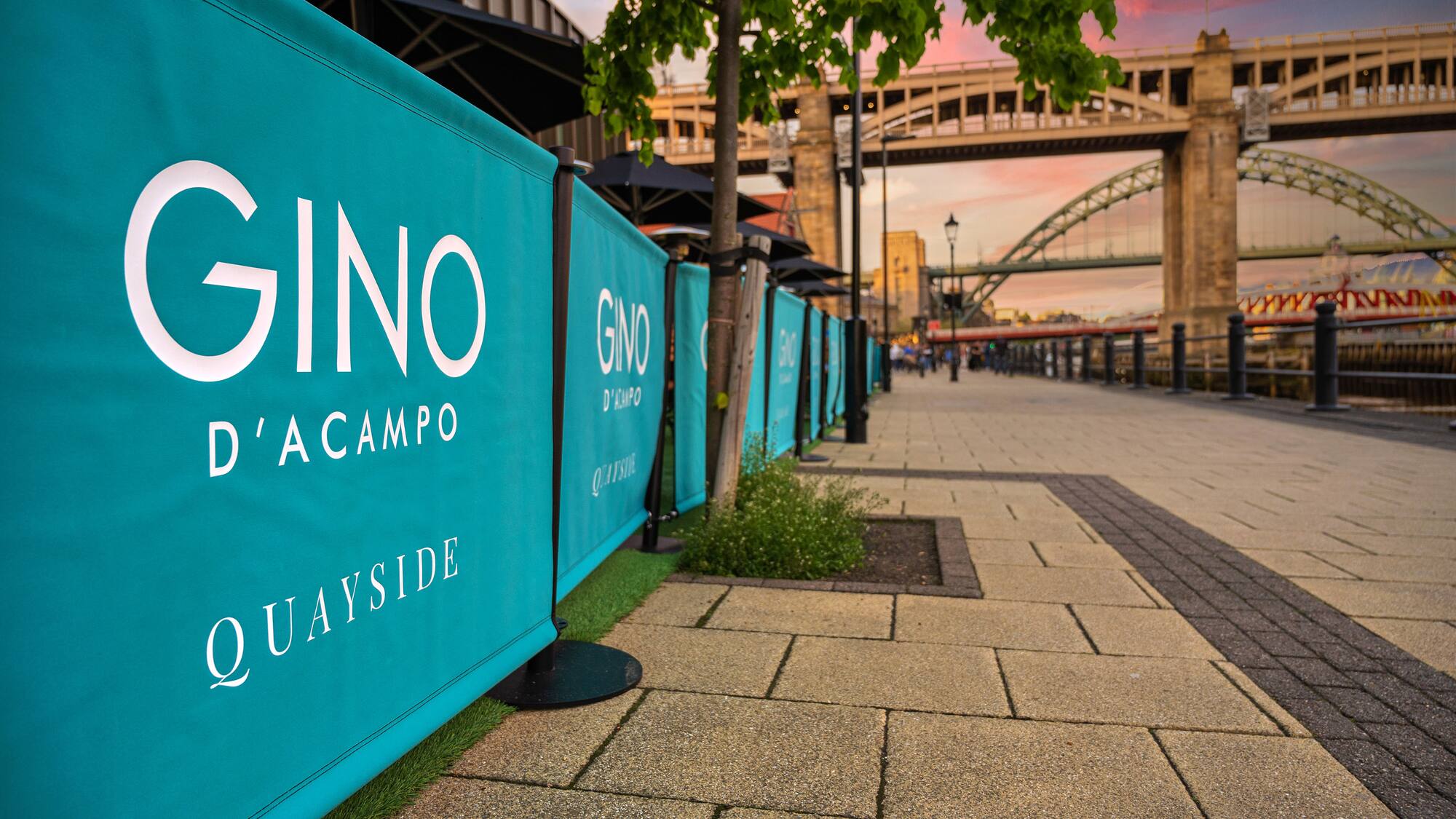 a blue sign on a sidewalk