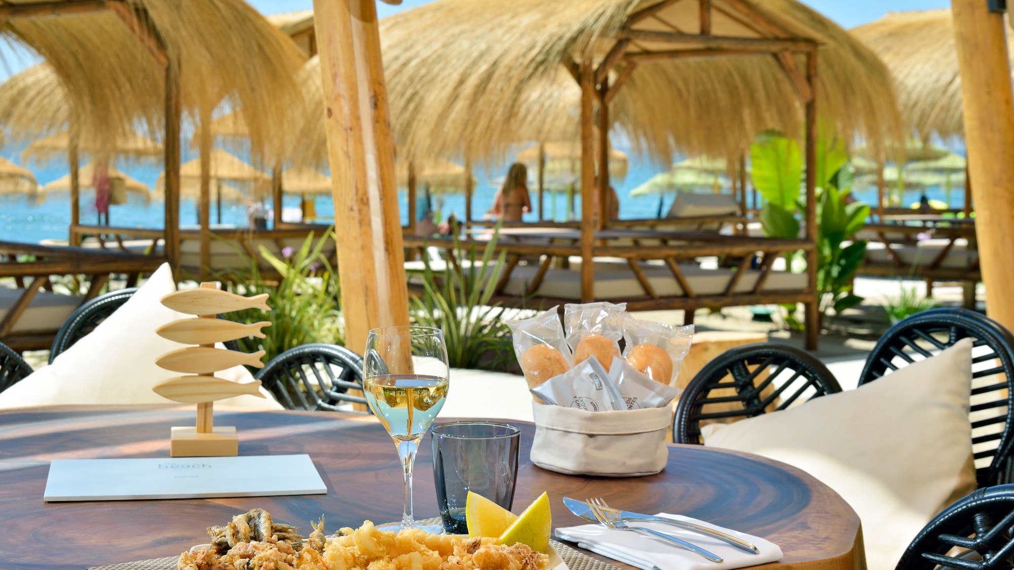 a table with food and a glass of wine on it