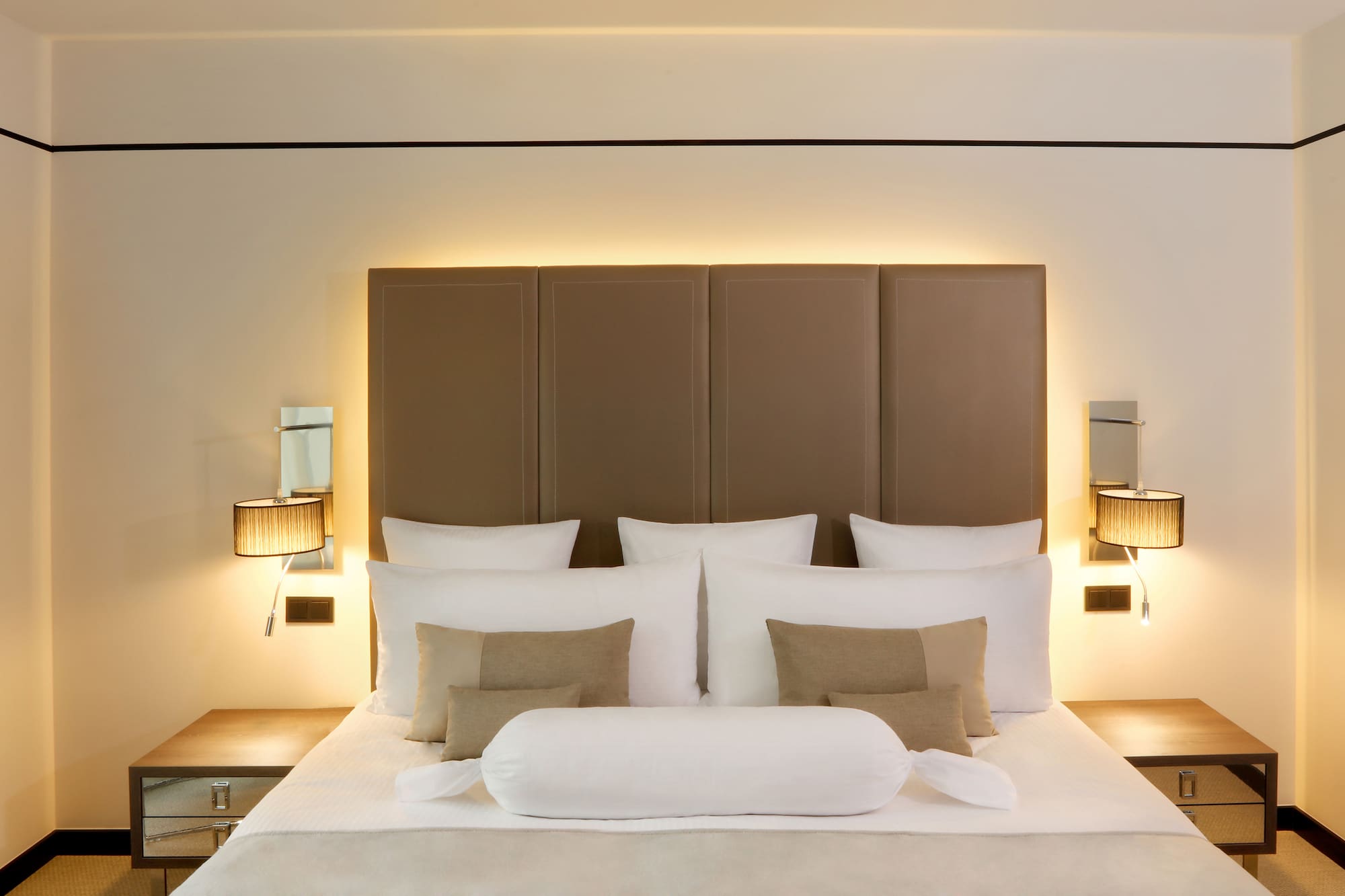 a bed with pillows and a headboard