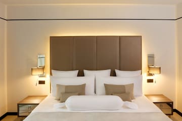 a bed with pillows and a headboard