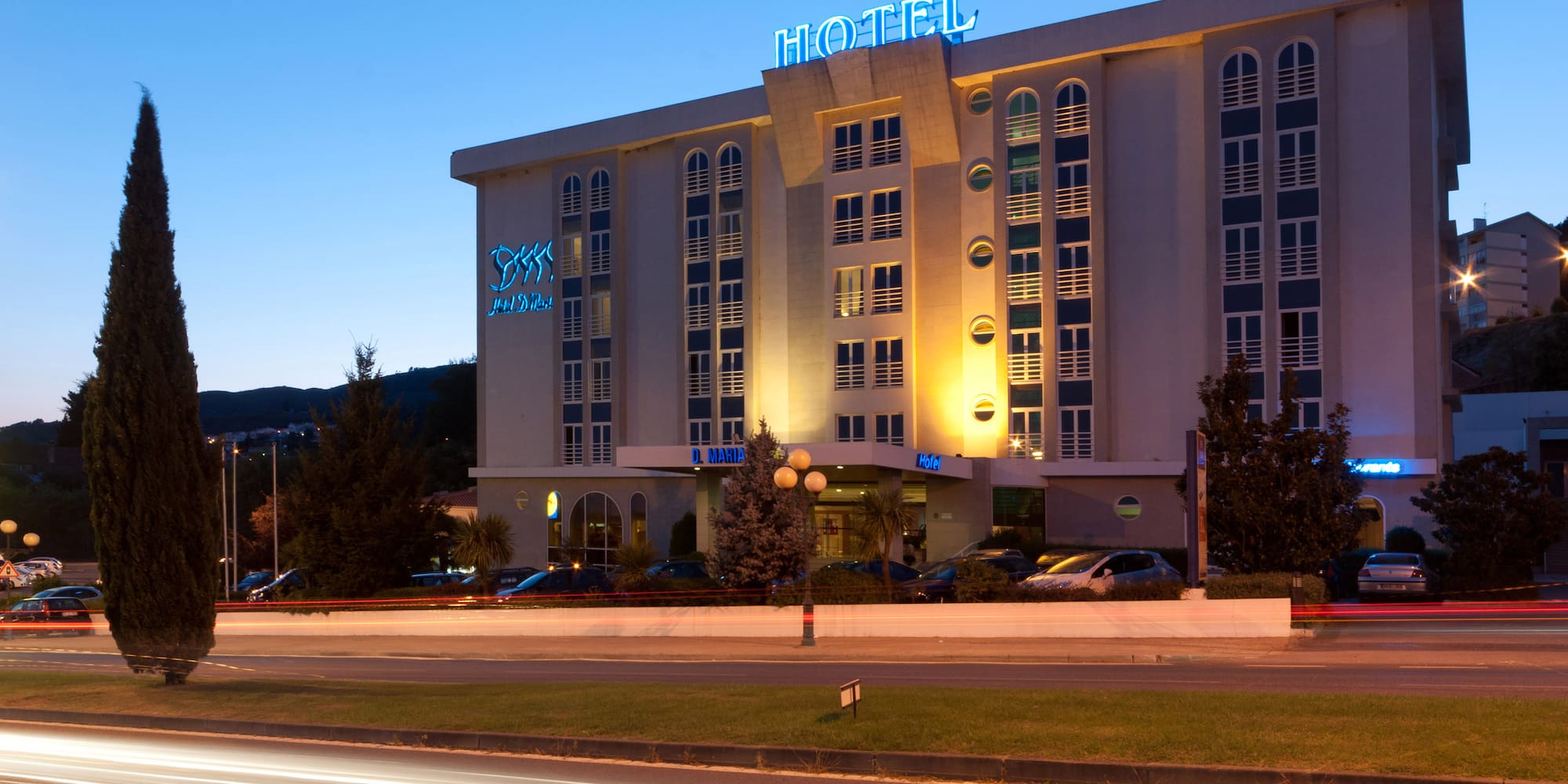 a hotel with lights on the front