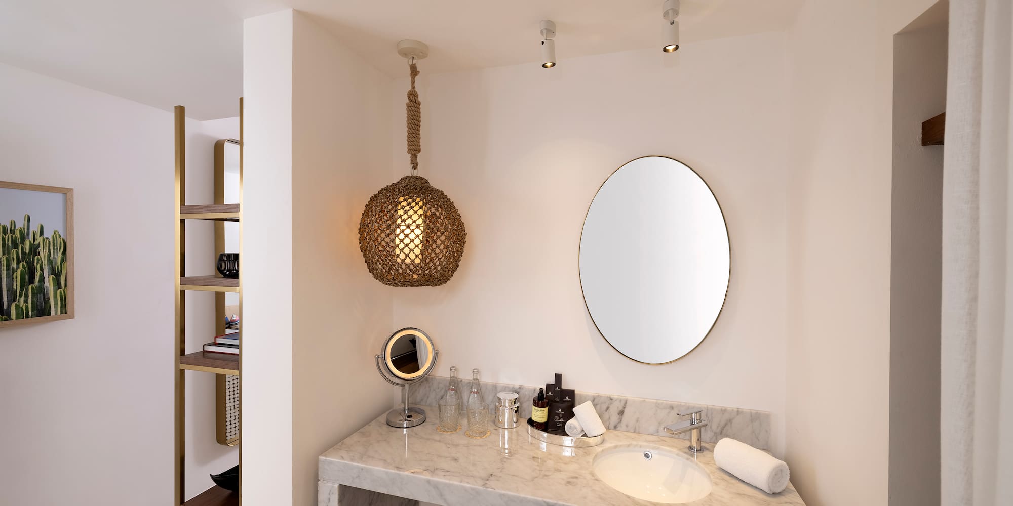 a bathroom with a mirror and a sink