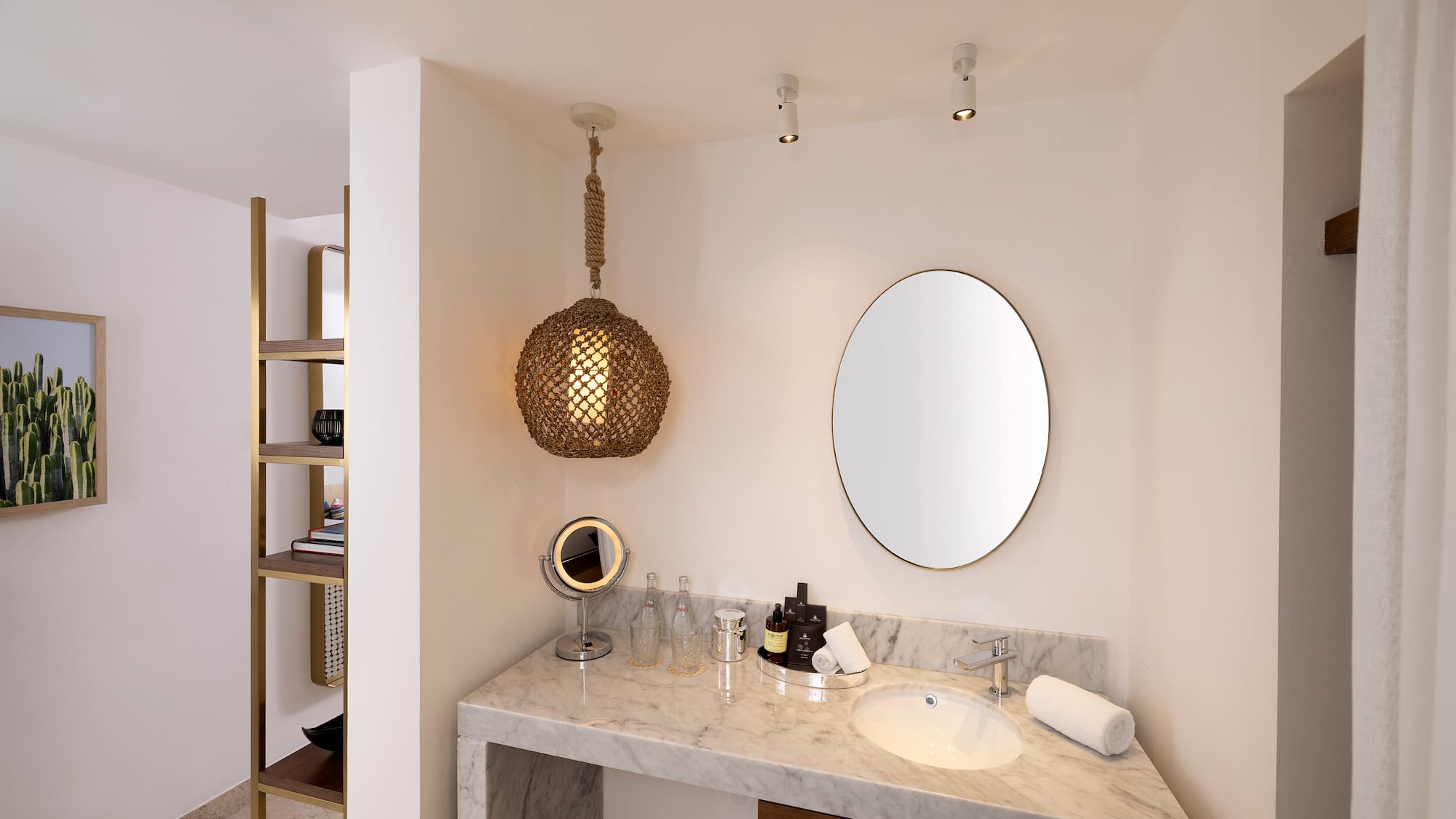 a bathroom with a mirror and a sink