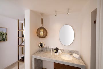 a bathroom with a mirror and a sink