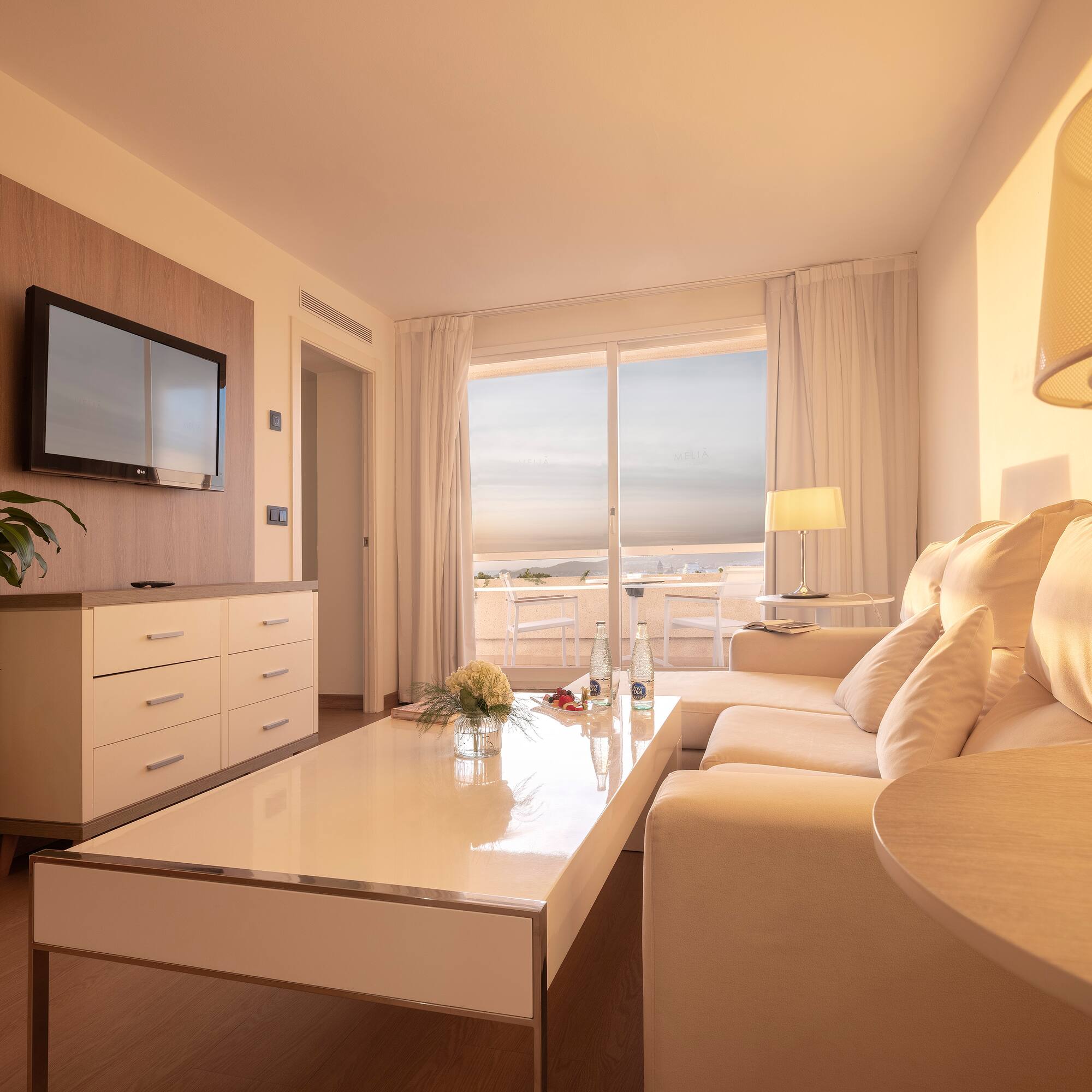 a living room with a couch and a television