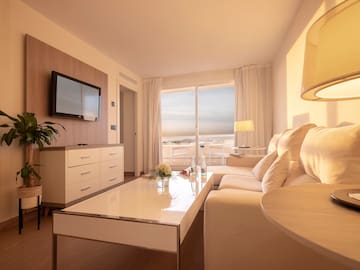 a living room with a couch and a television