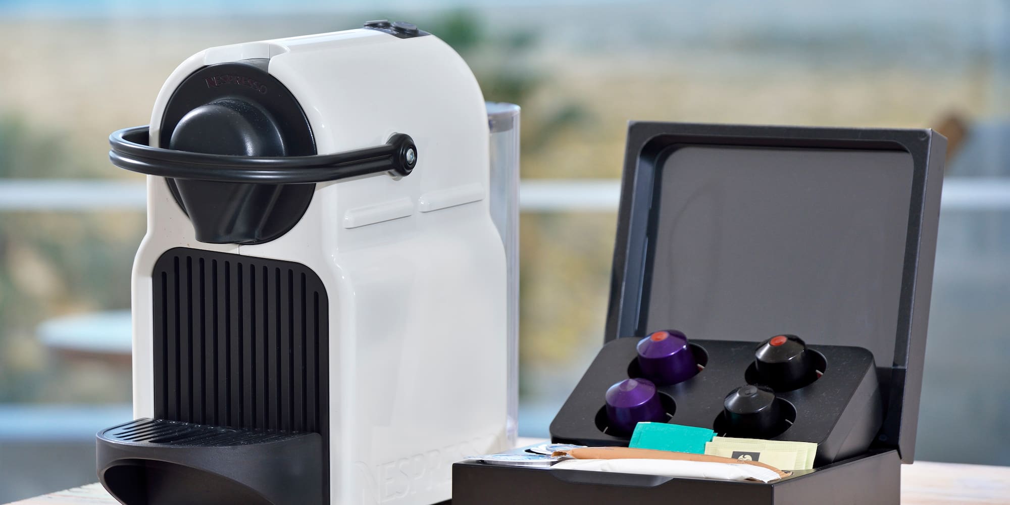 a white and black device with a black lid and a black box with a black lid