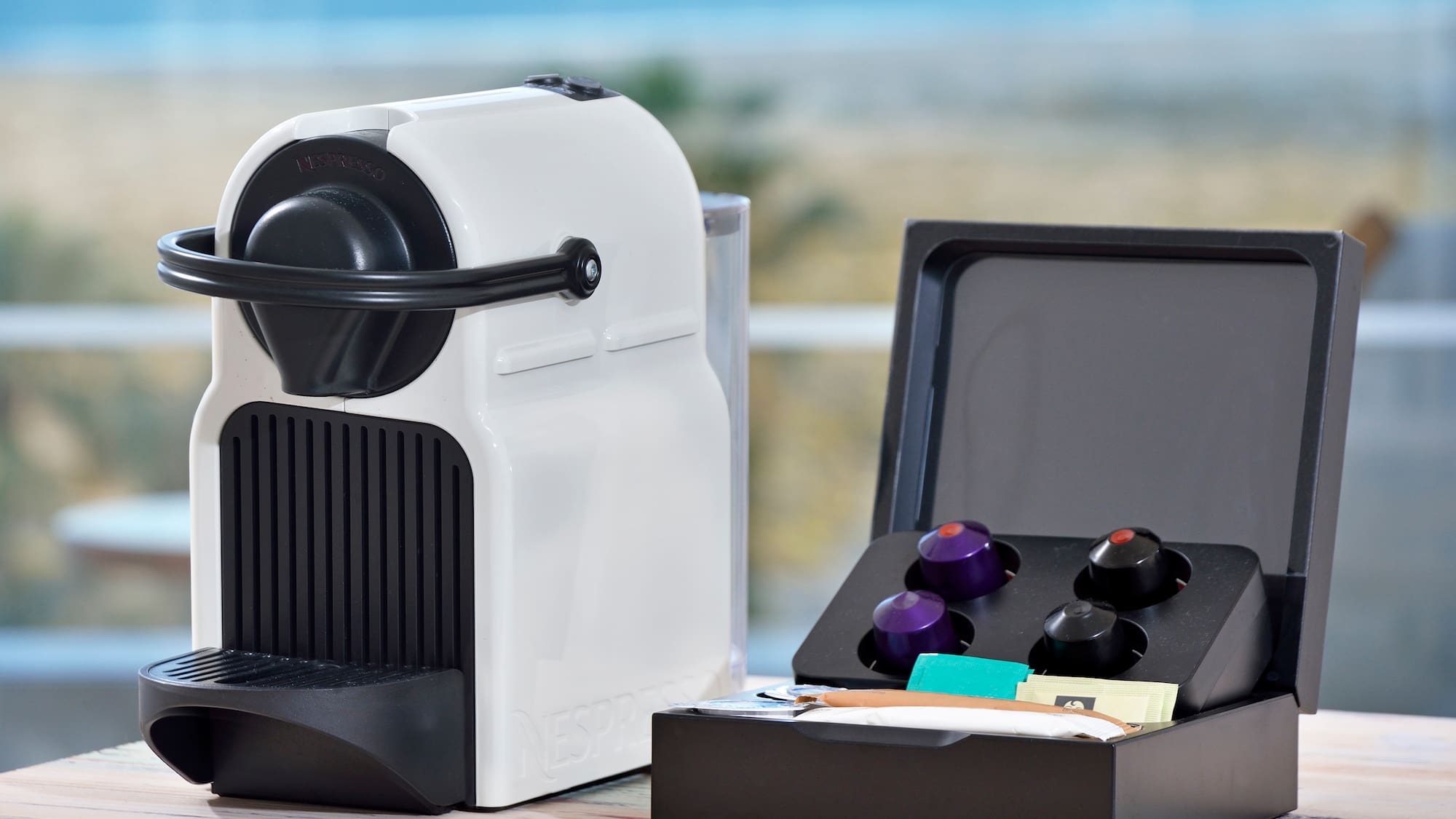 a white and black device with a black lid and a black box with a black lid