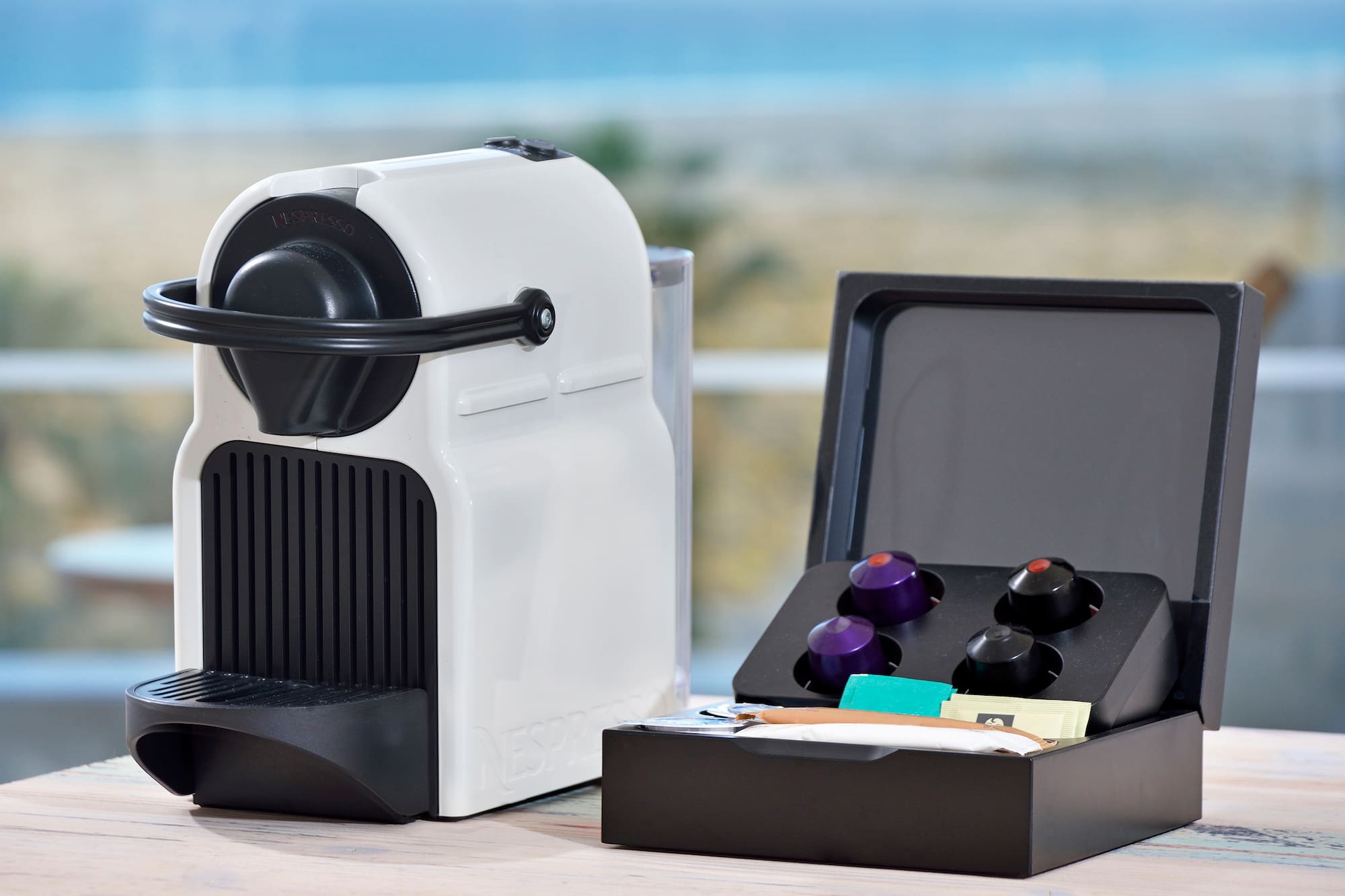 a white and black device with a black lid and a black box with a black lid