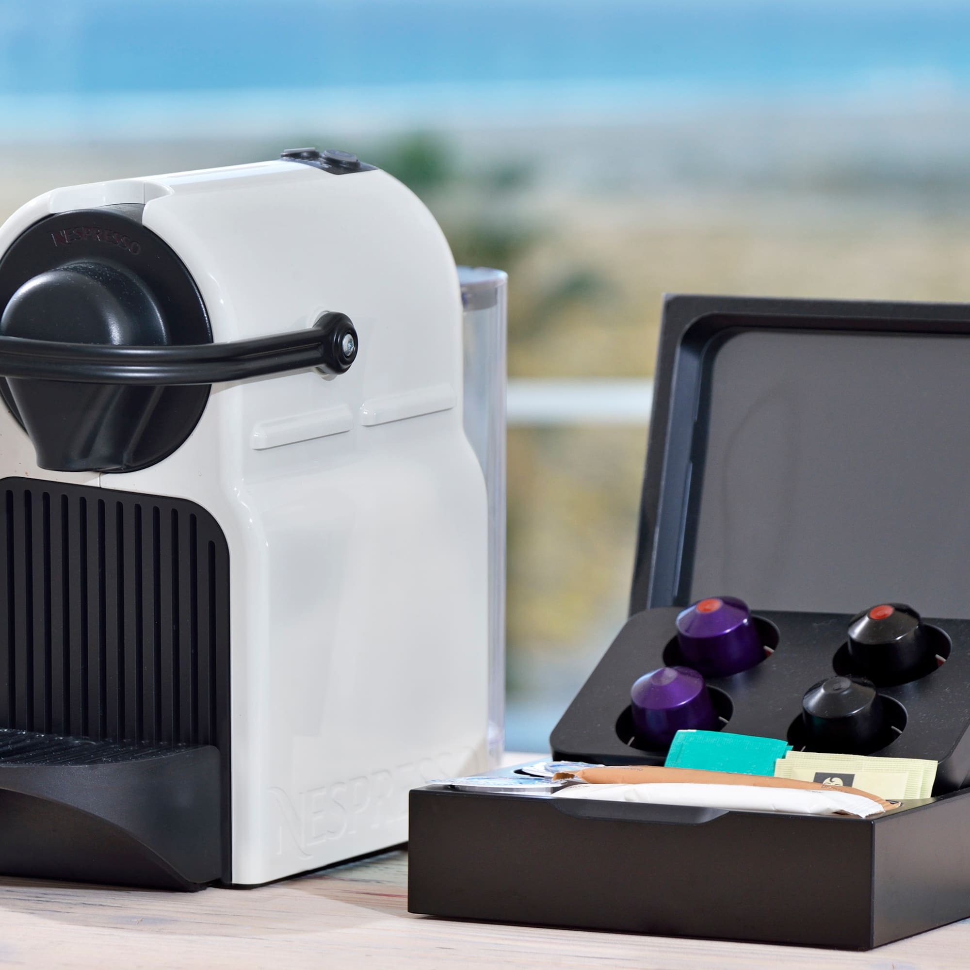 a white and black device with a black lid and a black box with a black lid