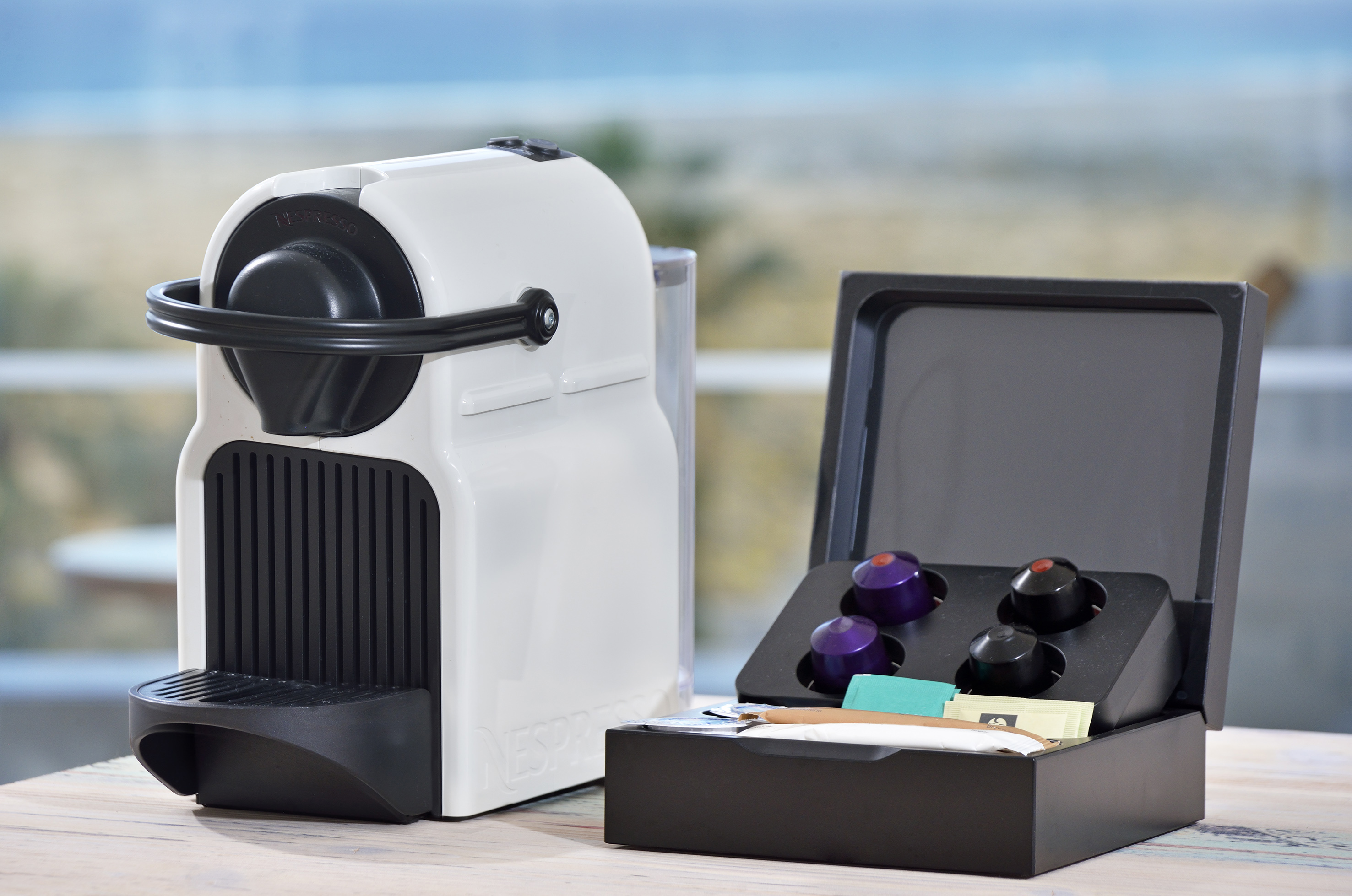 a white and black device with a black lid and a black box with a black lid