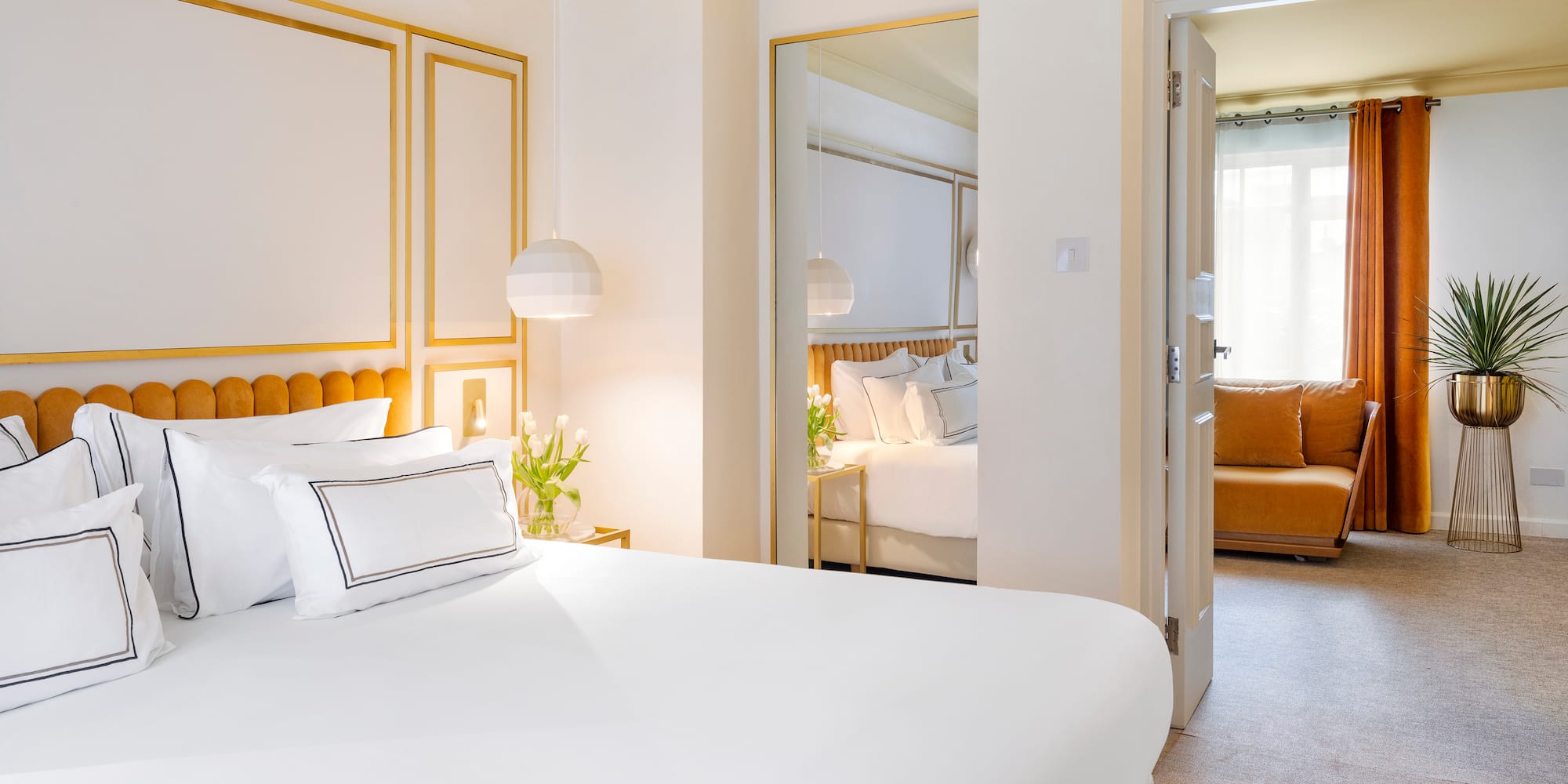 a bedroom with a bed and a mirror