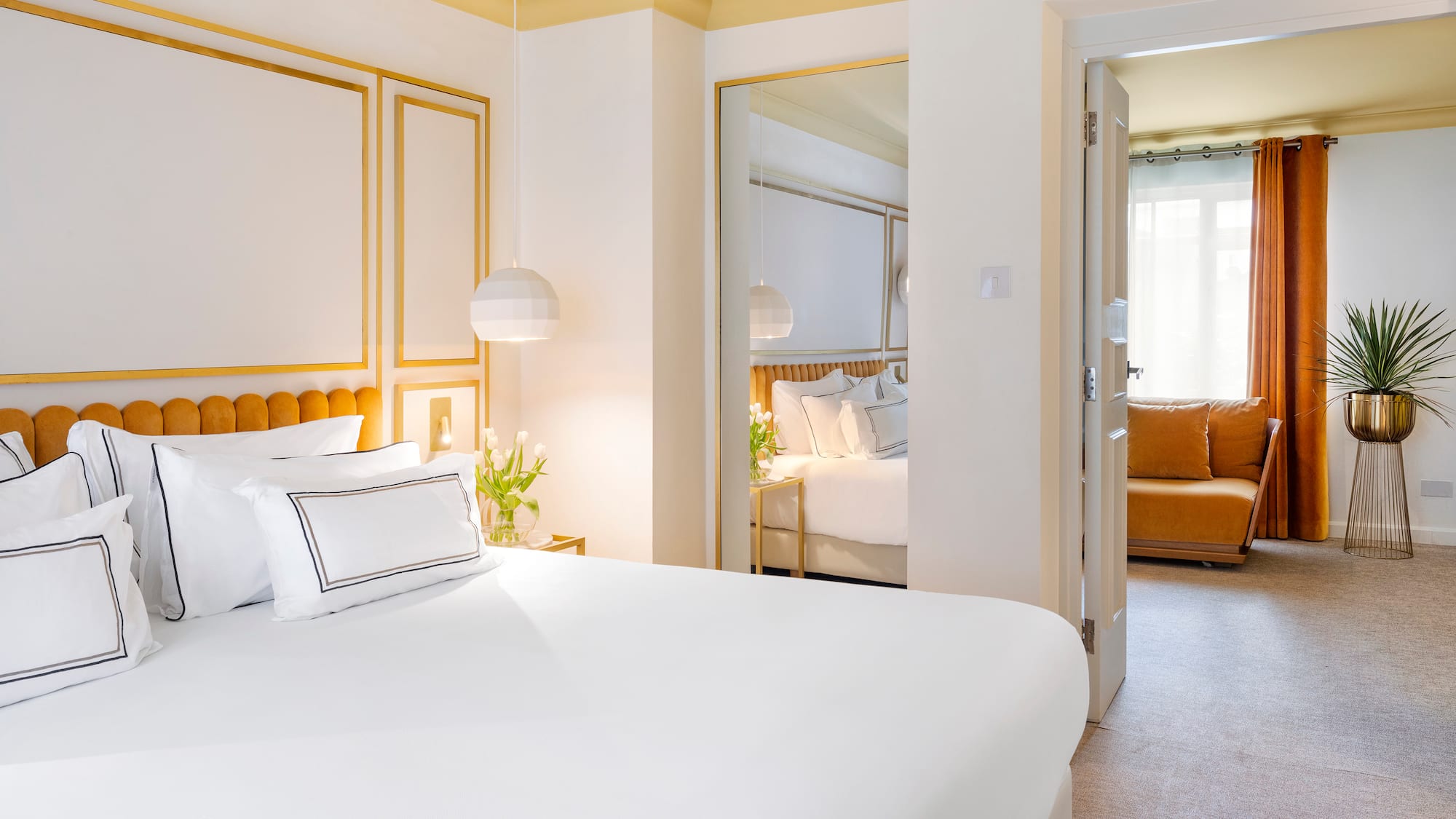 a bedroom with a bed and a mirror