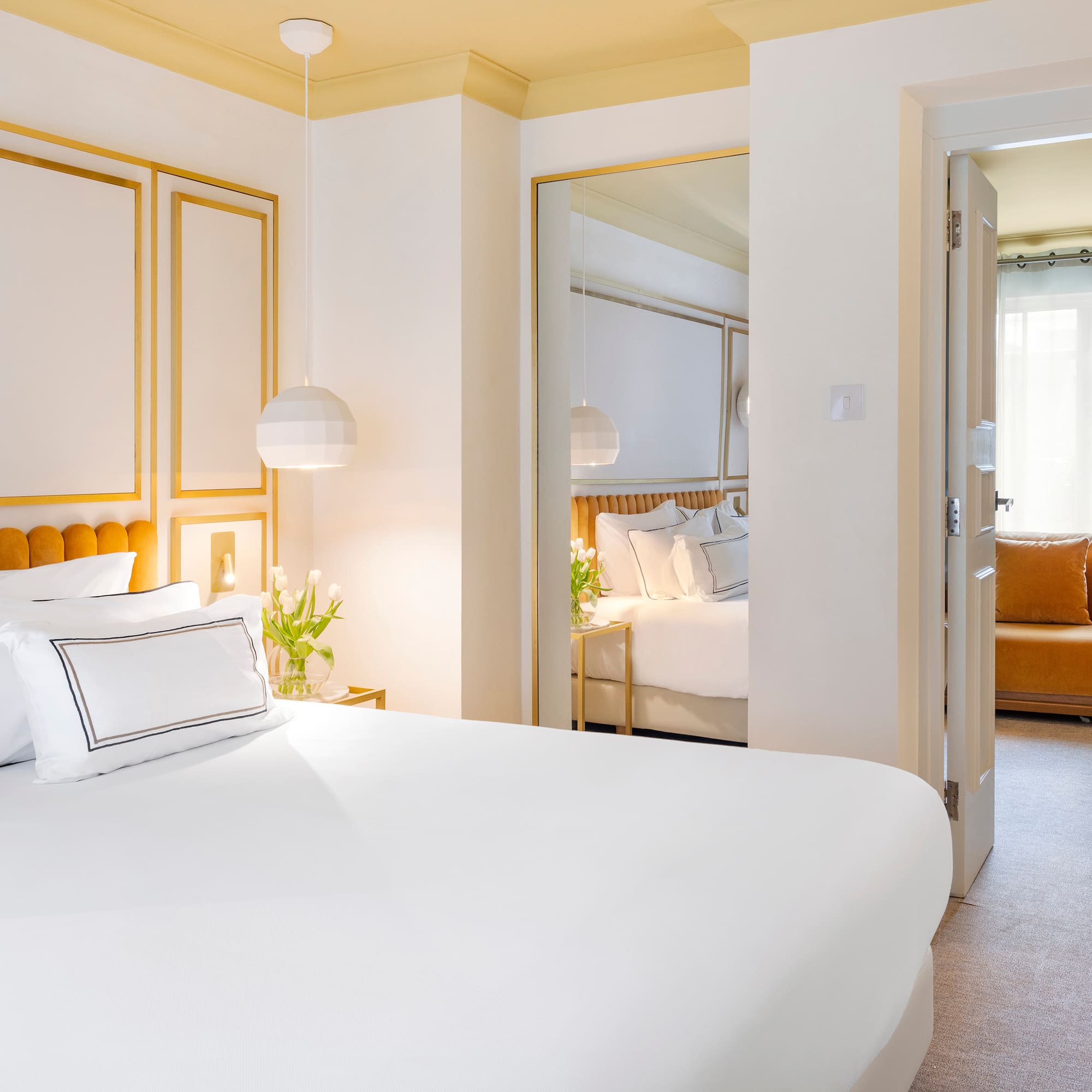 a bedroom with a bed and a mirror