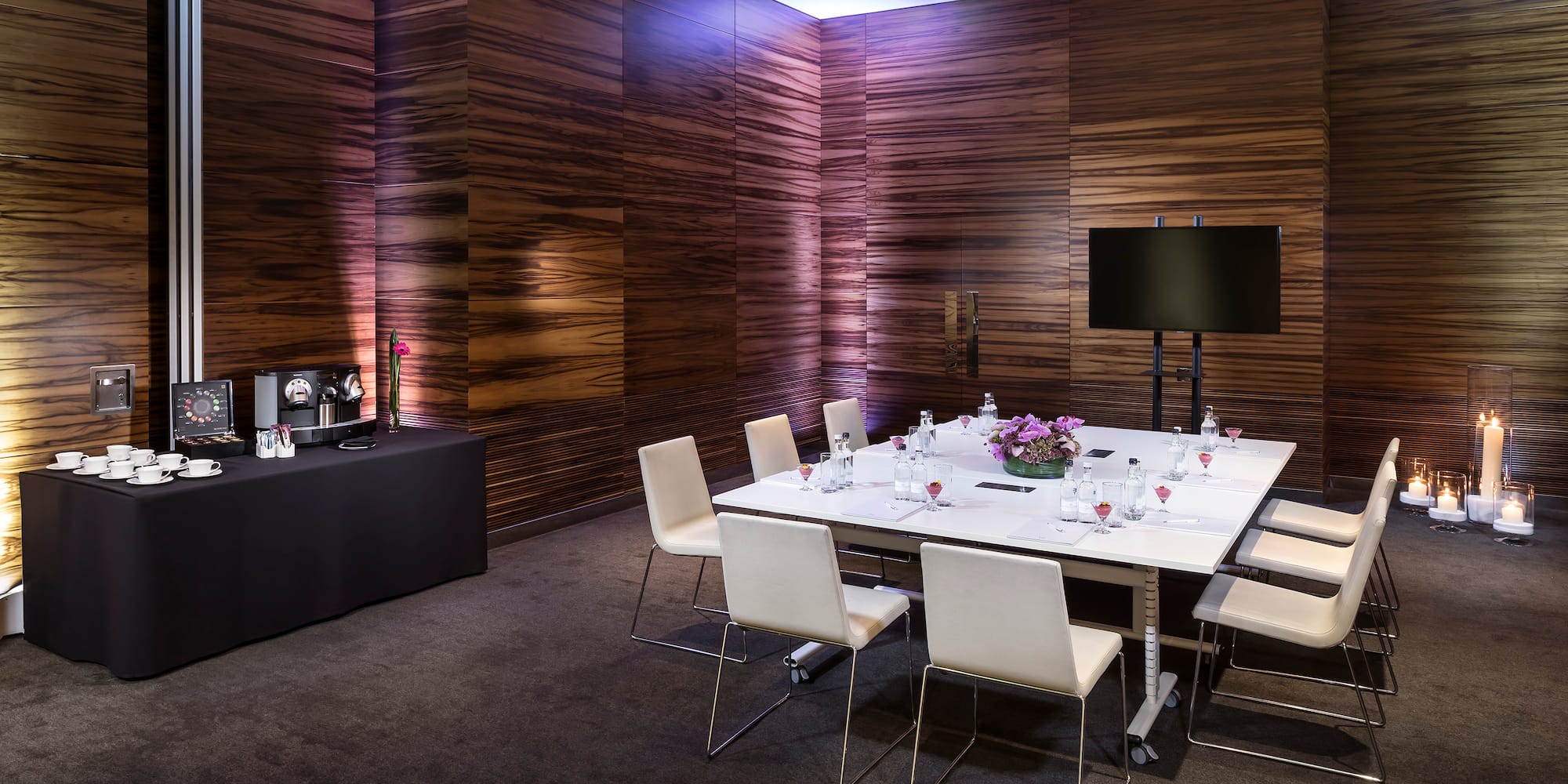 a room with a table and chairs