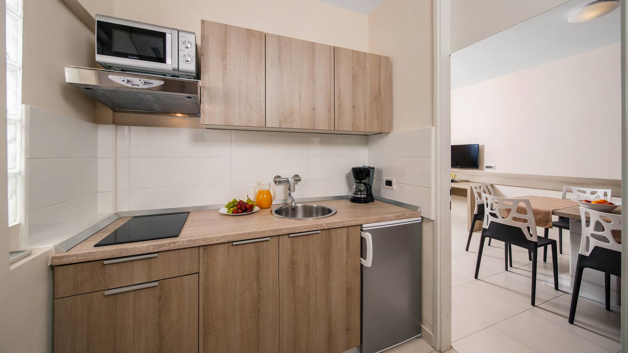 a kitchen with a sink and a microwave