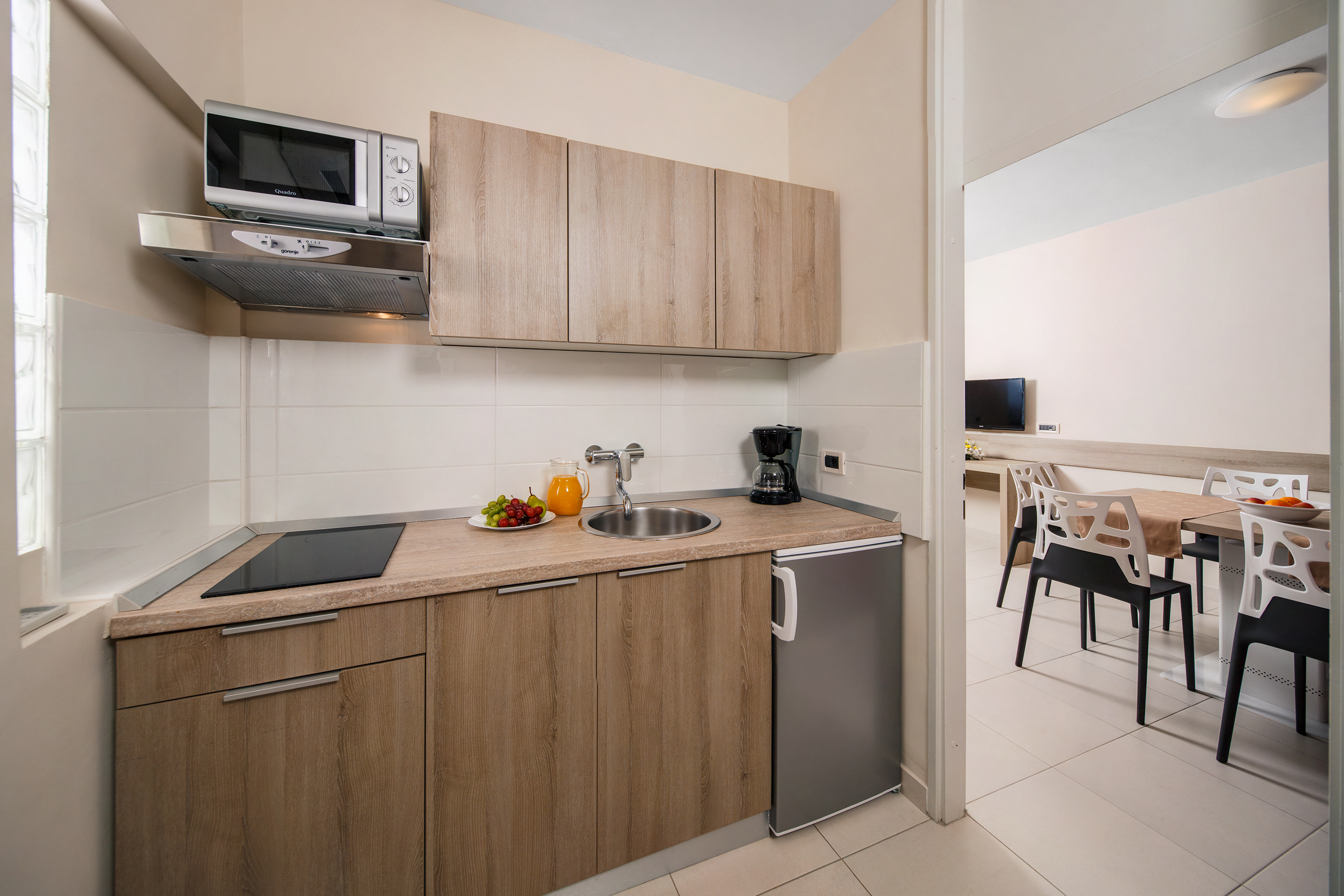 a kitchen with a sink and a microwave