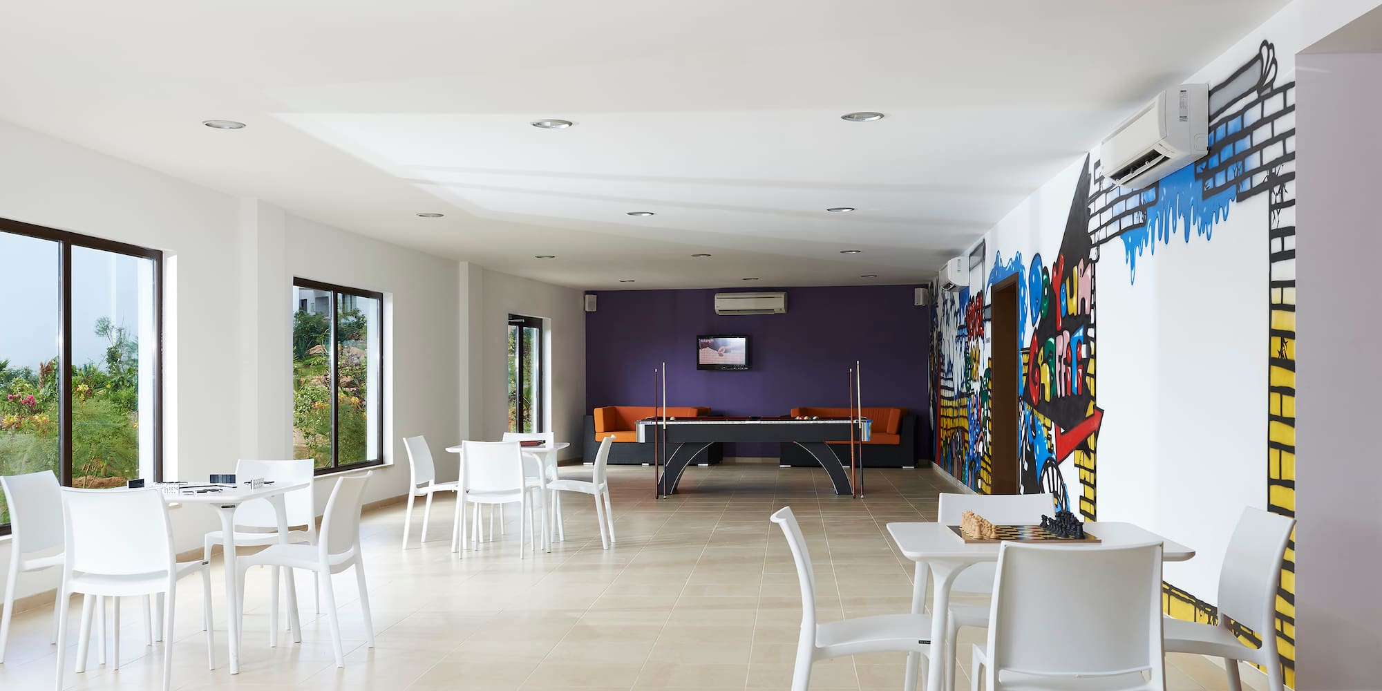 a room with tables and chairs