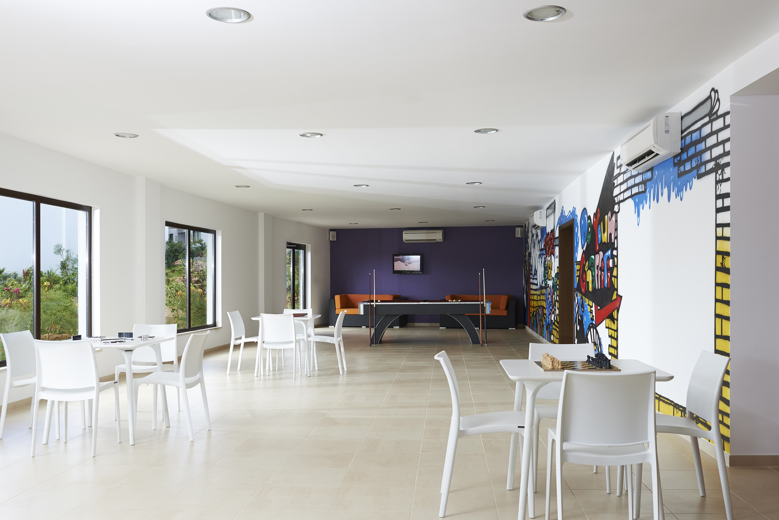 a room with tables and chairs