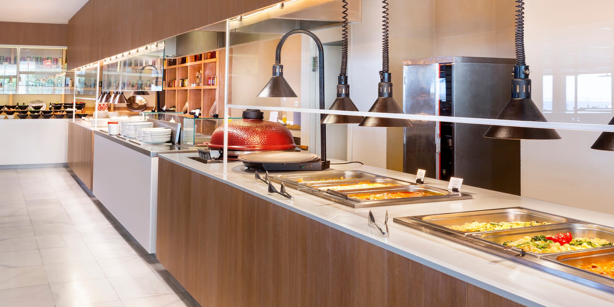 a buffet line with food on the counter