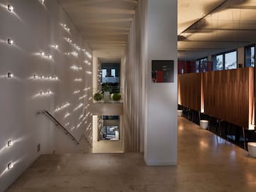 a hallway with lights on the wall