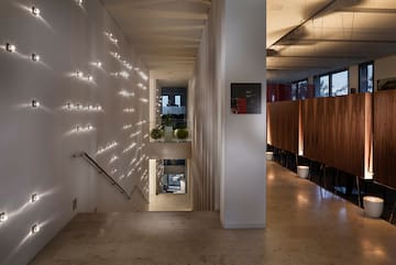 a hallway with lights on the wall