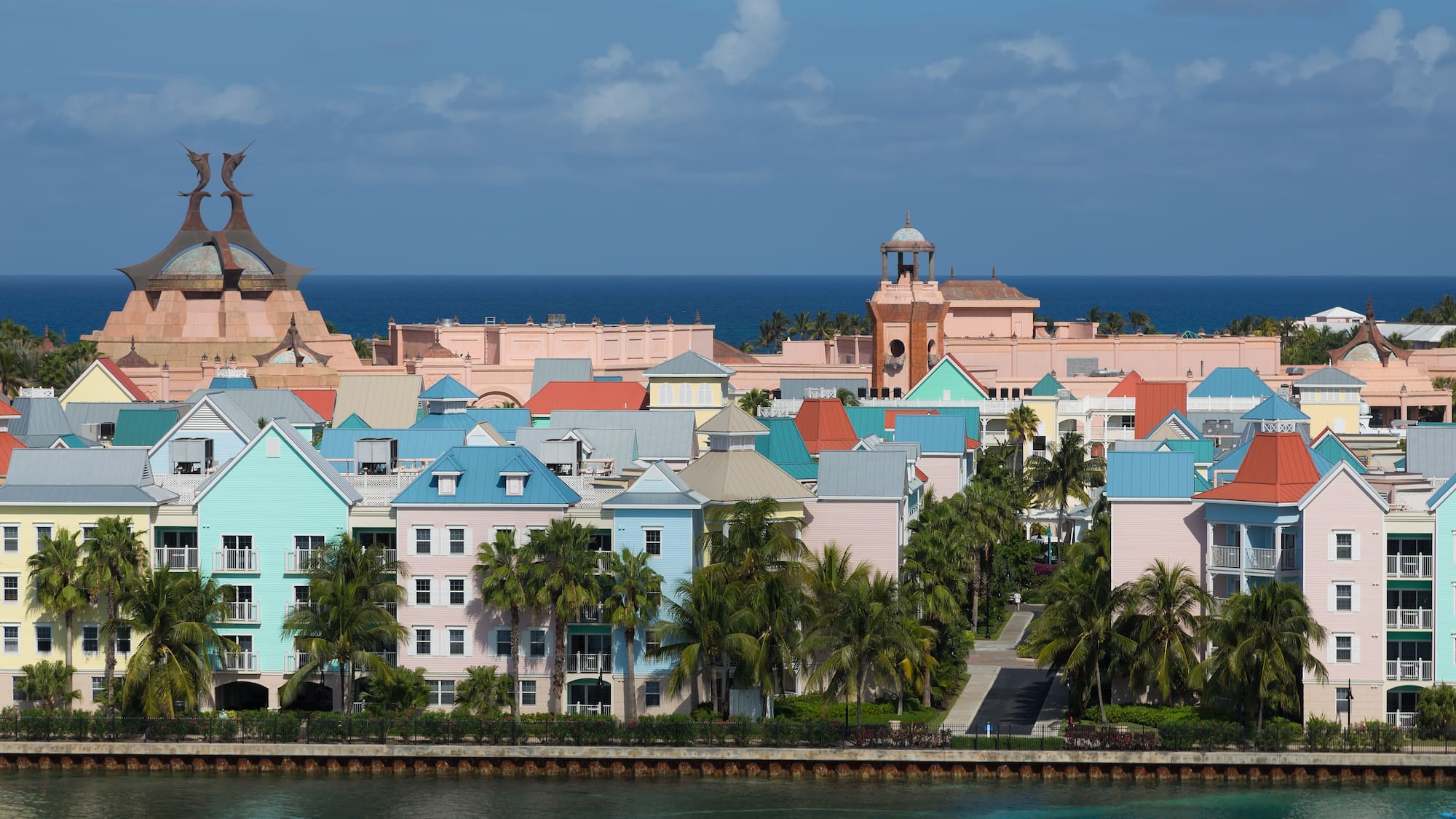 a group of colorful buildings next to a body of water