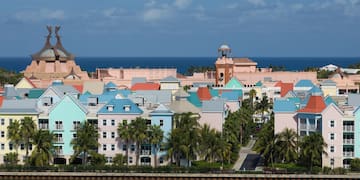 a group of colorful buildings next to a body of water