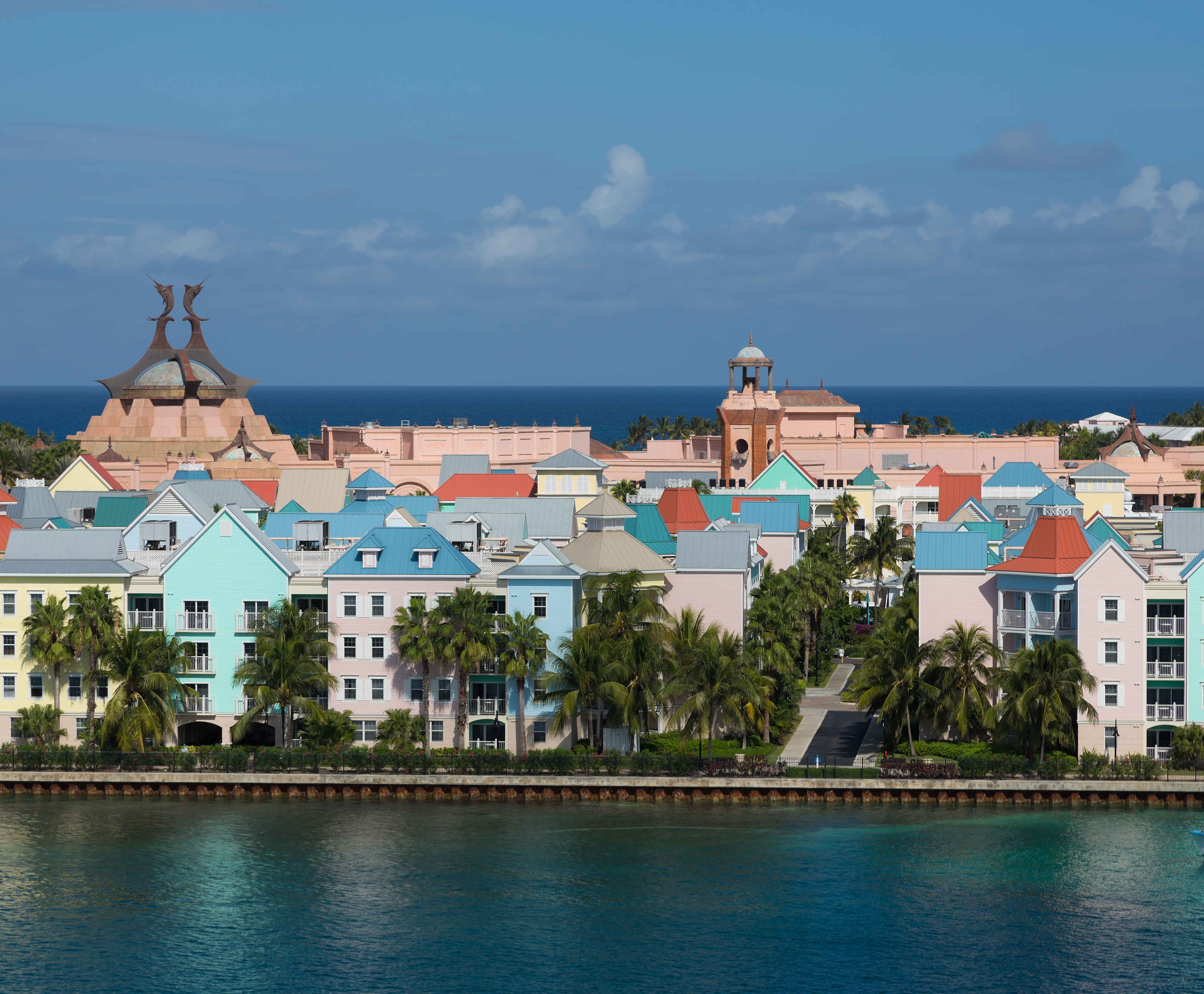 a group of colorful buildings next to a body of water