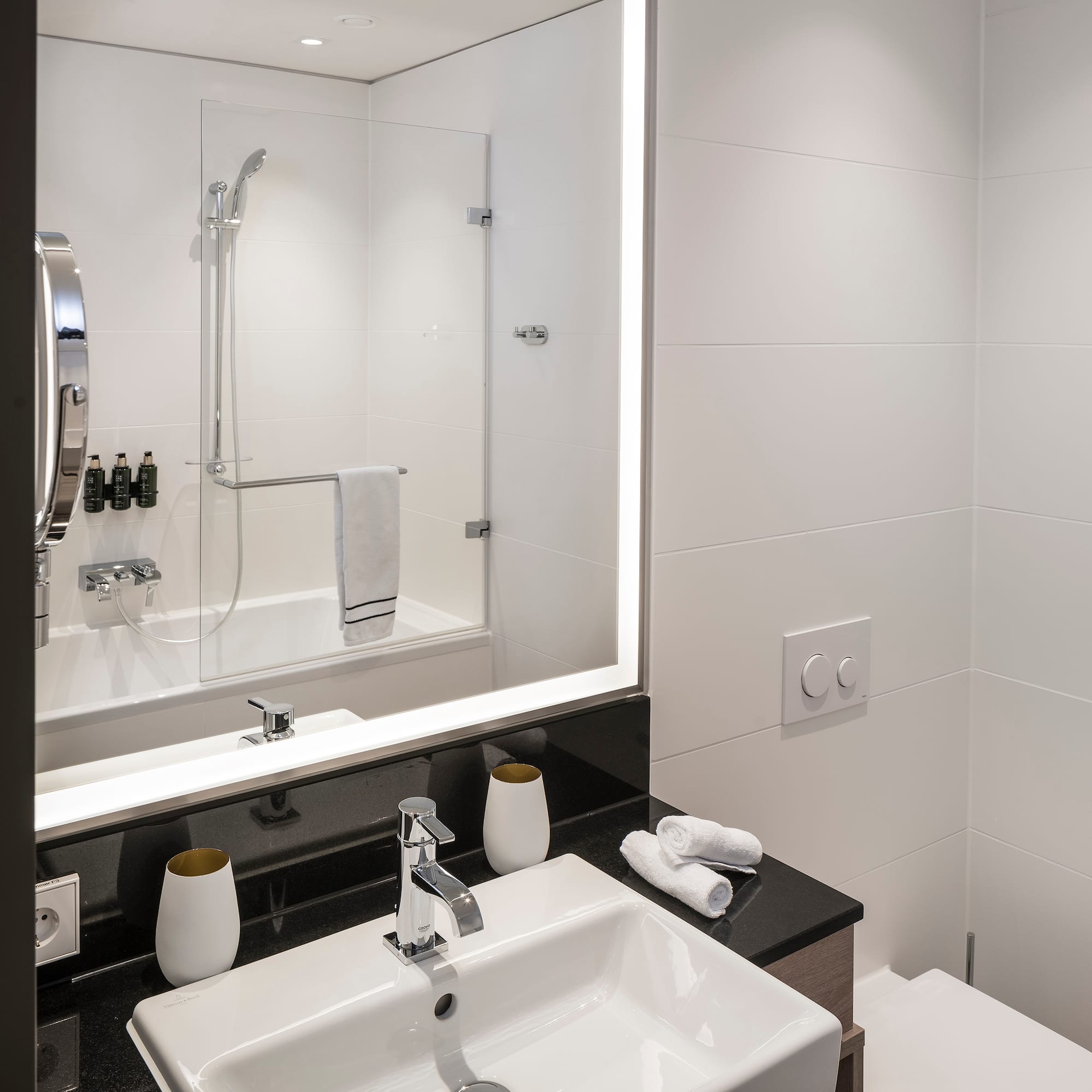 a bathroom with a mirror and sink