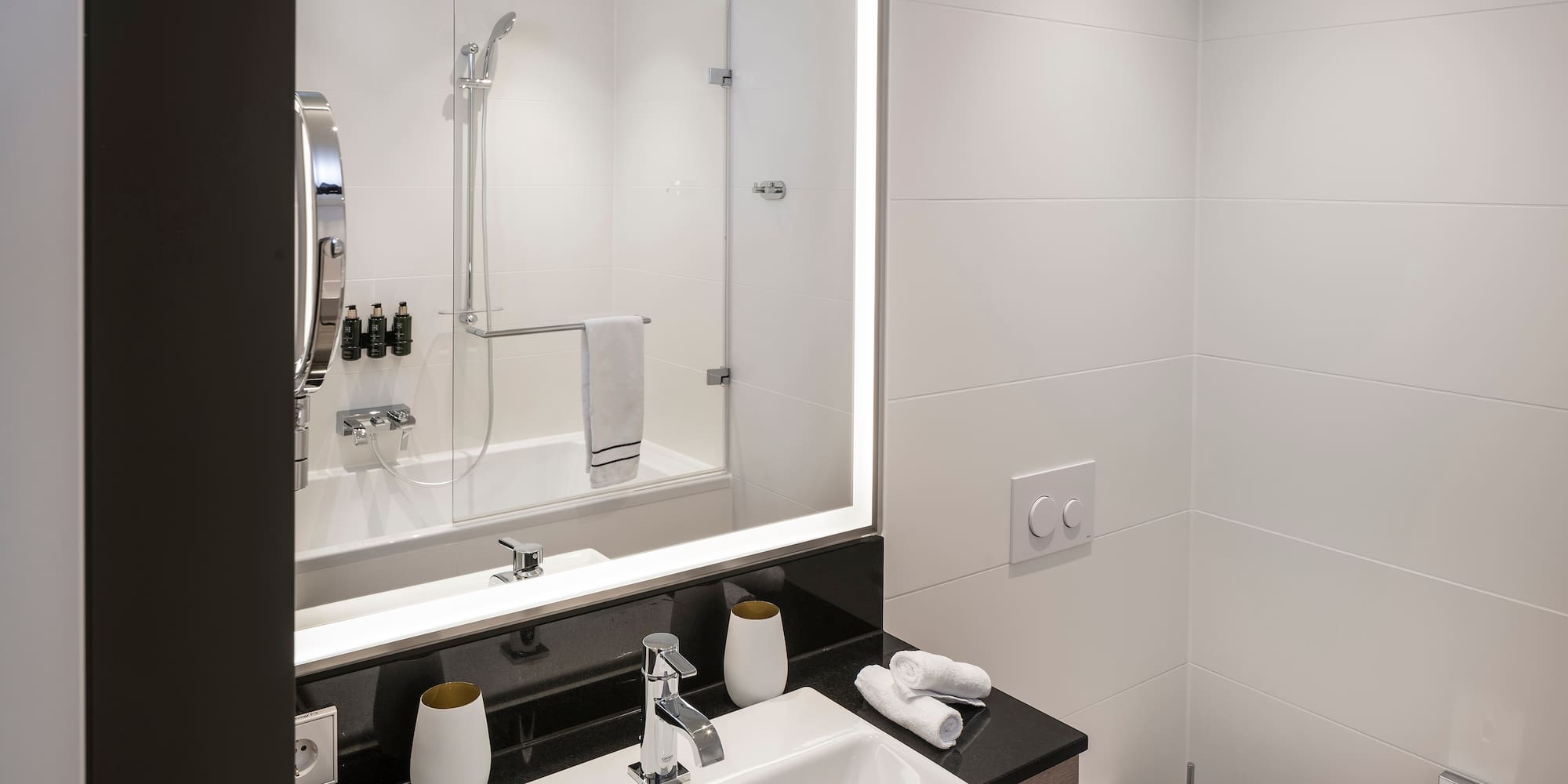 a bathroom with a mirror and sink