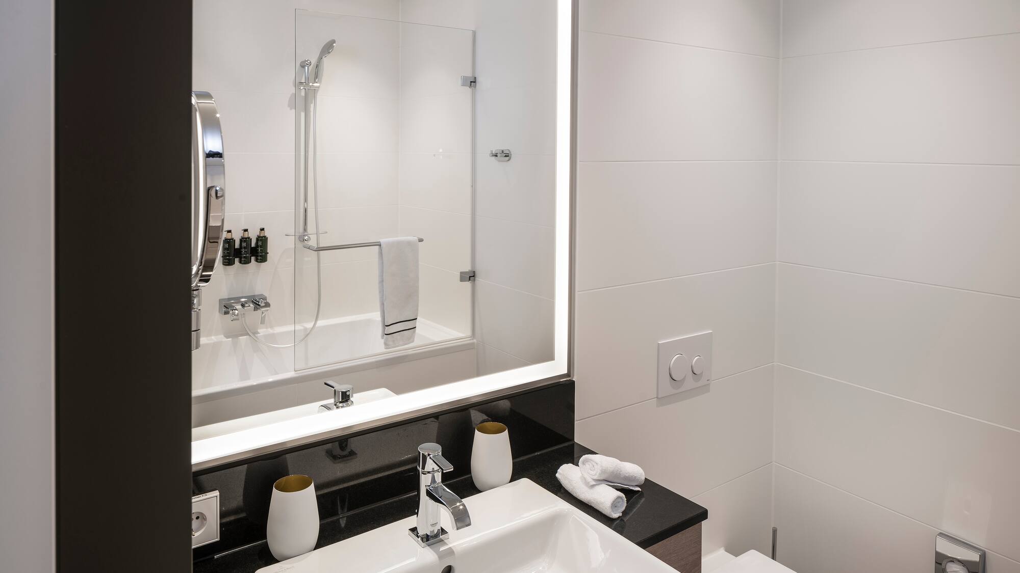 a bathroom with a mirror and sink