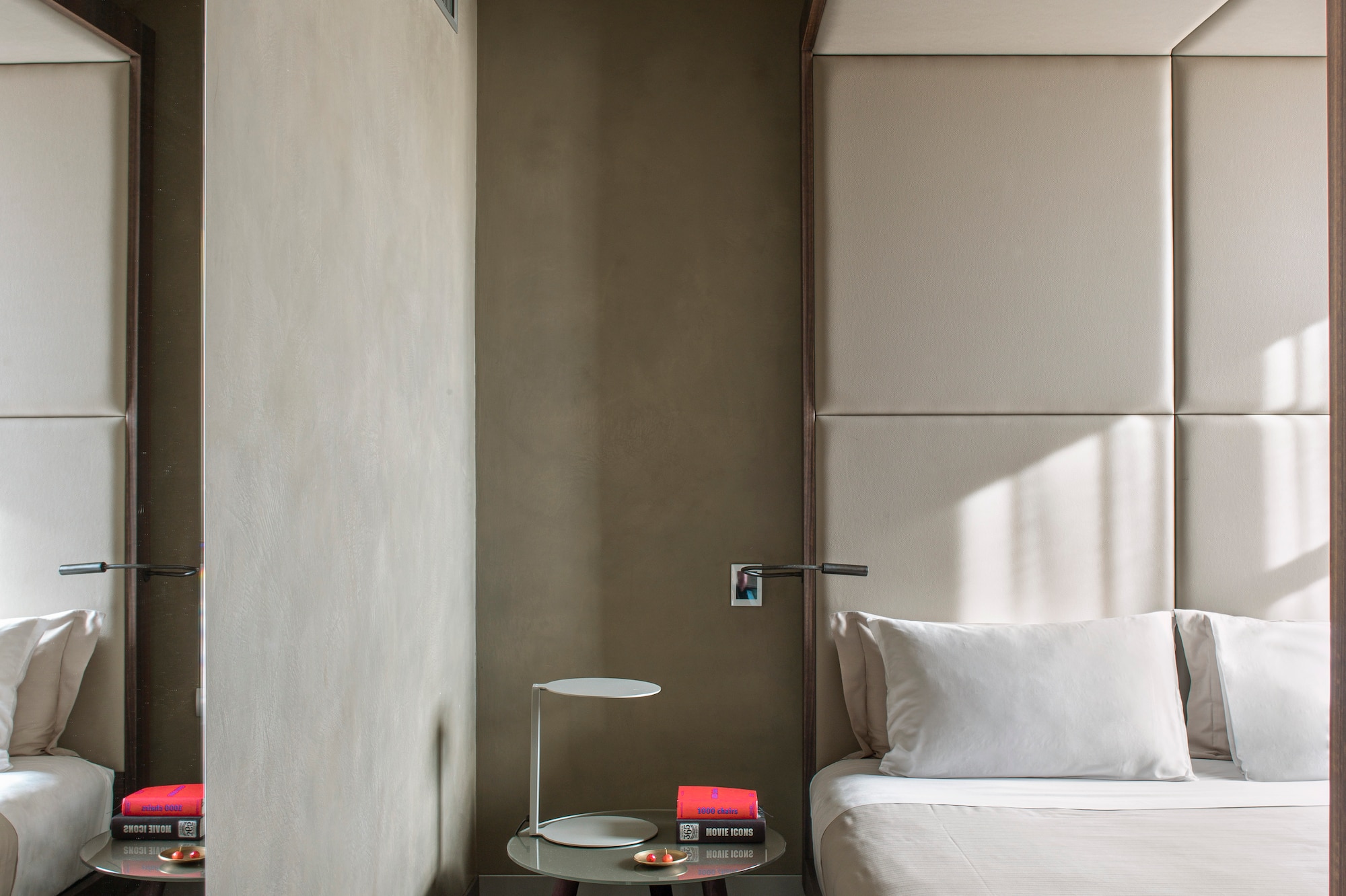 a bedroom with a bed and a table